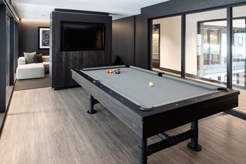 Resident social lounge with demonstration kitchen and billiards table